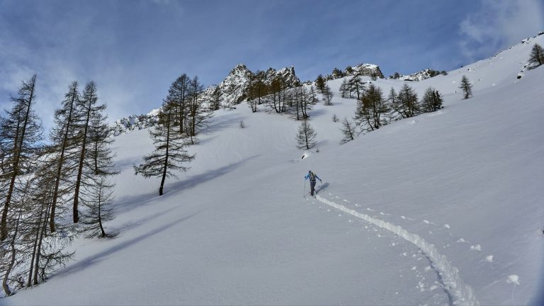 a person skiing down a snowy mountain