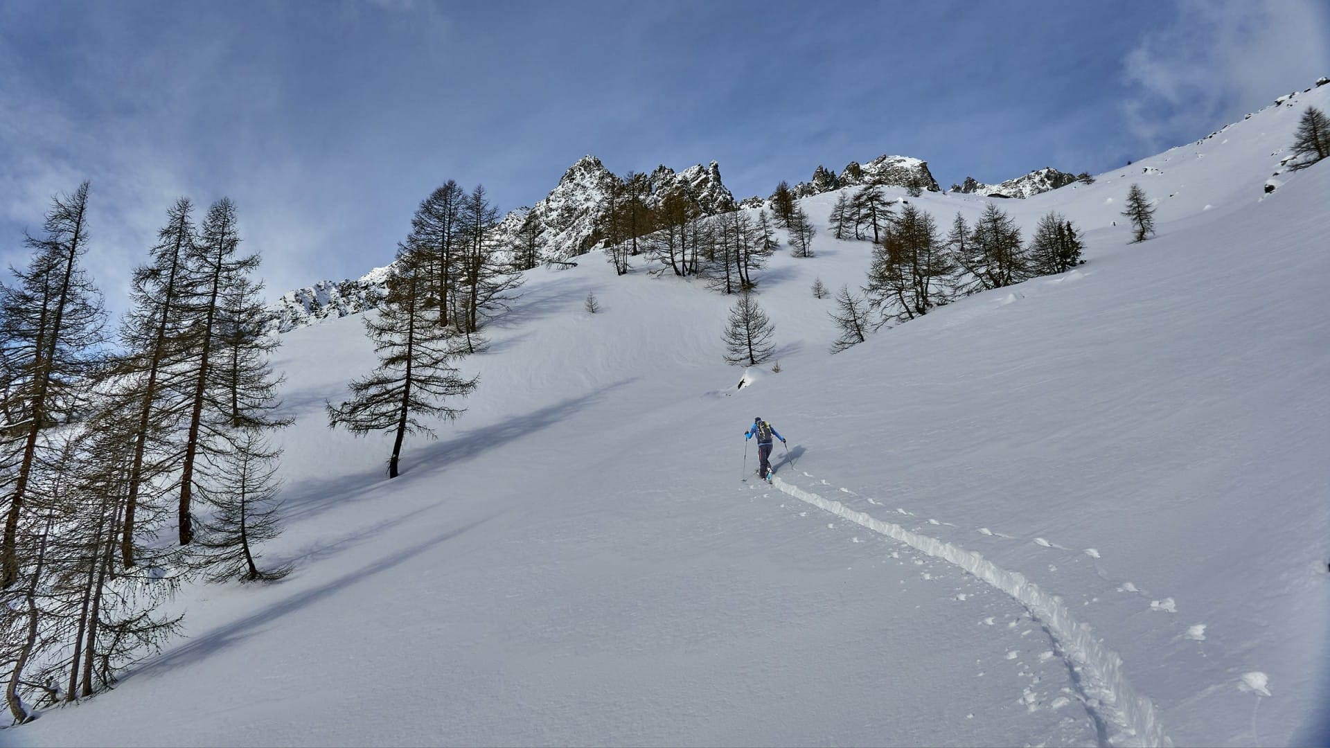 a person skiing down a snowy mountain